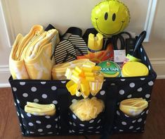 a black and white polka dot basket filled with items