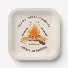 a paper plate with an image of a campfire and some marshmallows