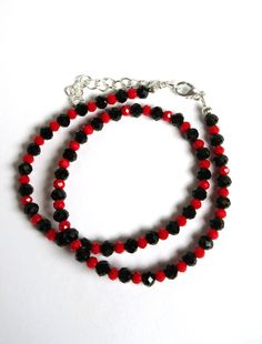 This black and red choker is made with tiny 4x3mm red opaque rondelles, and 6x4mm black crystal rondelles. The 16 inch necklace is adjustable with a 2 inch silver plated extender. This necklace will be slipped into an organza bag and shipped in a bubble mailer. Red Choker, Black Beaded Bracelets, 16 Inch Necklace, Necklace Ideas, Small Beads, Red Bracelets, Beaded Anklets, Bubble Mailer, Crystal Choker