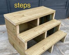 three wooden shelves stacked on top of each other with the words steps written above them