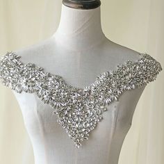 This beautiful and sparkling rhinestone applique with beaded crystal details, it is nice pieces sewing onto/hot glued on any craft projects To apply appliques carefully using applique scissors to cut the edges (if needed ).Use applique pins to hold in place. Fix the applique on the dress using glue or needle to sew the applique on the dress or garment,the crystal patch can arranged by your own . it can be made in nice neckline collar , bridal veil. any sort of stuff. appliques for clothes, dress Wedding Dress Bodice, Bodice Applique, Sewing Lace, Sparkle Wedding Dress, Sparkle Wedding, Lace Socks, Rhinestone Appliques, Wedding Dress Accessories, Rhinestone Dress