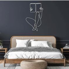 a bedroom with a bed, nightstands and a painting on the wall above it