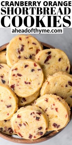 cranberry orange shortbread cookies in a bowl with text overlay that reads, cranberry orange shortbread cookies