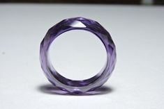 Buyer Will Receive 1 Piece Attractive Purple Amethyst Zirconia Full Faceted Gemstone Made Ring Band.you will really love it.you will gift it to your love ones and friends. Product Details Product Name - Purple Zirconia Gemstone Made Ring Band Gemstone - Zirconia Quantity - 1 Piece ----------------------------------------------------------------------------- THIS BEAUTIFUL ITEM IS AVAILABLE ONLY ON ETSY ------------------------------------------------------------------------------------ Note - Ki Modern Purple Amethyst Jewelry, Purple Cubic Zirconia Round Jewelry, Purple Faceted Wedding Rings, Modern Purple Rings For Gift, Faceted Amethyst Purple Ring, Modern Purple Ring For Gift, Faceted Amethyst Ring In Purple, Modern Purple Wedding Jewelry, Purple Amethyst Crystal Ring