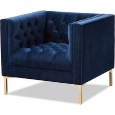 a blue velvet chair with wooden legs