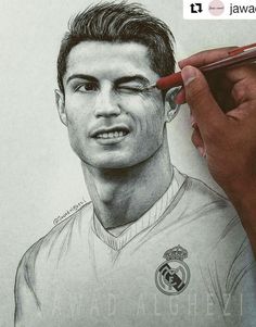 a pencil drawing of a soccer player holding a ball in his right hand and looking at the camera