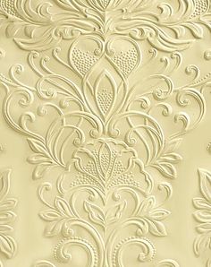 an ornate wallpaper pattern in gold and white