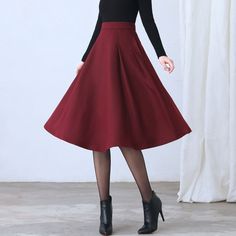 "★★ FEATURES * Wool skirt * Polyester lining * Two side seam pockets * Right zipper closure * pleated detail * Plus size full skirt * A Line Skirt * Perfect for Winter, autumn, spring * Dry clean ★★ The model is 170 cm (5′ 7″) tall with a 80 cm (31.5\") bust, 66 cm (26\") waist. She is wearing the red wool skirt in size XS. ★★ Bespoke Order Service If you Request other color Request the length Your height is not between 155 cm- 172 cm Your weight is over 75 kg I can do it for you, It will need s Retro A-line Winter Skirt, Winter Wool A-line Skirt, Retro Winter Skirt, Red Long Skirt For Fall, Red Winter Skirt With Relaxed Fit, Red Knee-length Skirt For Fall, Red Lined Skirt For Winter, Red Full Skirt For Fall, Fall Red A-line Skirt