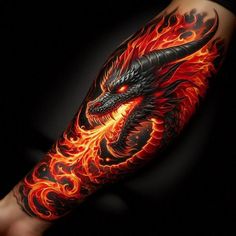 a man's arm with flames and a black dragon tattoo on the arm,