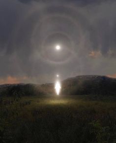 a man standing in the middle of a field under a dark sky with an eyeball