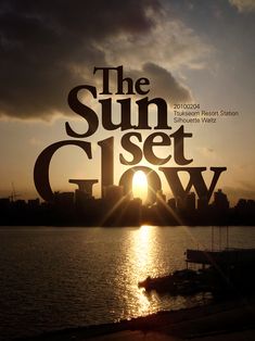 the sun set glow poster is shown in front of a body of water with boats on it