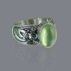 Vintage Green Moonstone Ring Silver Angel for Women Jewelry Occasion: Party, wedding, birthday, anniversary, gift mosaic: ring with green stone Style: Vintage Shape\pattern: Geometric Setting Type: Tension Setting Rings Type: Cocktail Ring Occasion: Engagement, Anniverssary Metals Type: Silver Material: Green Emerald Item Type: Rings Gender: Women Brand Name: Genuine-Gemstone Green Spiritual Jewelry For Anniversary, Green Crystal Gemstone Ring For Spiritual Wear, Green Art Deco Jewelry With Accent Stones, Art Deco Green Jewelry With Accent Stones, Green Spiritual Birthstone Rings, Green Moonstone Jewelry Gift, Spiritual Green Birthstone Ring, Elegant Green Cabochon Moonstone Ring, Elegant Green Moonstone Promise Ring