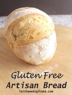 a loaf of artisan bread sitting on top of a cutting board with the words gluten free artisan bread