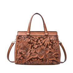 "This Mellow World Salome floral satchel is perfect for daily use with a vintage touch. This Mellow World Salome floral satchel is perfect for daily use with a vintage touch. Watch the product video here. Embossed floral design Removable crossbody strap 8.5""H x 12.5""W x 4""D Handle: 5.5'' drop Crossbody strap length: 18.5"" to 20"" Removable/adjustable crossbody strap Zipper closure Gold-tone plating Interior: 2 slip pockets and 2 zip pockets Exterior: 1 zip pocketCONSTRUCTION & CARE Body: Mexican Handbags, Touch Watch, Gauze Pants, Book Tote Bag, Pocket Books, Western Wear For Women, Fancy Bags, Product Video, Purse Accessories