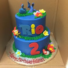 a blue birthday cake with the number two on it