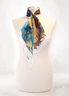 Square scarf Peacock Feather is hand painted with art nouveau pattern of flowers and peacock feathers, in vivid blue & gold color composition. Size: 22 by 22 in (55 by 55 cm) 34 by 34 in (88 by 88 cm) Silk: natural Habotai Light (semi - transparent, very delicate and light, a bit glossy) This silk scarf is made to order and I will need 3 days for painting. The Peacock Feather scarf was designed by me as an Art Nouveau woman accessory! Please note that I don't track my designs, so the scarf f Elegant Silk Scarf As A Gift, Elegant Silk Scarf As Gift, Elegant One Size Silk Scarf Gift, Elegant Summer Handkerchiefs As Gifts, Blue Silk Scarf As Gift, Artistic Silk Scarf For Summer, Artistic Silk Scarf As A Summer Gift, Artistic Silk Scarf As Summer Gift, White Silk Scarf As A Gift