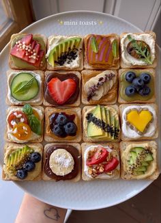 a white plate topped with lots of different types of food on top of each other