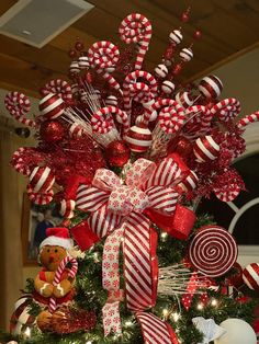 a christmas tree decorated with candy canes and candies