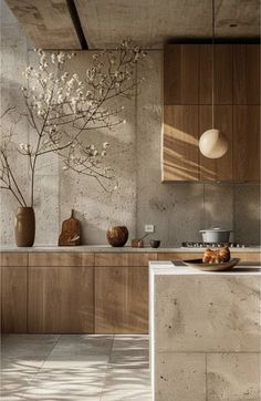 the kitchen is clean and ready for us to use in its new home, which has been designed with natural materials such as concrete