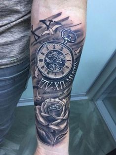 a person with a clock and roses tattoo on their arm