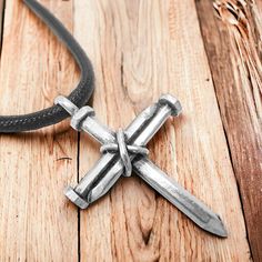 Design & Symbolism: The pendant is designed as a nail cross, using three nails to form the shape of the cross, representing the crucifixion. The equation "3 Nails + 1 Cross = 4 Given" is a symbolic reminder of Christ's sacrifice and the forgiveness offered through it. Material: The pendant is crafted from antique lead-free pewter, giving it a rugged, vintage finish that adds to its stylish appeal. The pewter finish ensures durability while providing a timeless, rustic look. Pendant Size: Height: 1 inch Width: 1 1/4 inches Nail Cross Design, Cross Nail Designs, Nail Cross Necklace, Nail Cross, Layered Crosses, Garden Plant Stand, The Crucifixion, Mens Cross Necklace, Earring Holder