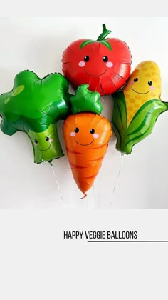 a bunch of balloons that have some vegetables on top of them with the words happy veggie balloons