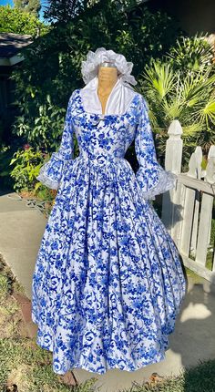 COLONIAL AMANDA GOWN  WITH MOB CAP AND LONG SCARF Made to your measurements  your choice of color or print. Priced for 16 women's sizes to  plus one size ------------------------ This Gown is the most popular reenactment day dress for schools and other colonial events. Colonial Period gowns were influenced by fashions worn in Europe. The most popular fabrics were linen, cotton, and light and airy floral prints.  3/4 length sleeve with gathered lace. Petticoats were often worn and were hooped to create a fuller look.  Middle-class housewives would wear this Gown. Colonial wear also dictated their financial status and occupation. I also sell petticoats for $50.00 pockets are sewn into the gown for cellphones... $15.00 each please message me before purchasing. AMANDA GOWN-  has a lined bodice Fitted Historical Style Dress For Fancy Dress, Royal Fitted Victorian Dress For Costume Party, Royal Gown For Costume Event, Historical Empire Waist Fitted Dress, 1710s Fashion, Mob Cap, Clothing Prints, Colonial Dress, Columbia Dresses