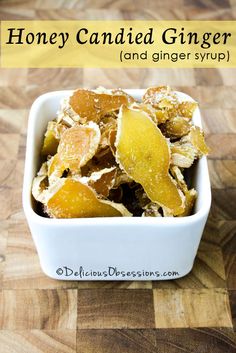 honey candied ginger and ginger syrup in a small white bowl on a wooden table