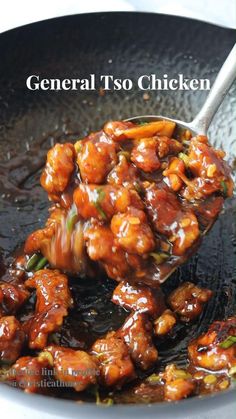 chicken is being cooked in a wok with sauce on top and the words general tso chicken above it