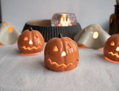 several carved pumpkins sitting on top of a table