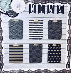 a white board with black and gold designs on it