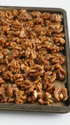 a tray filled with nuts sitting on top of a table