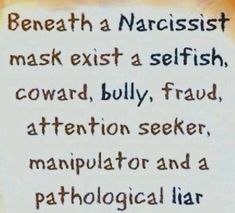 a sign that says beneath a narcisst mask exts a selfish, coward, bully, frad attention seeking, manpulator and a pathologicalia