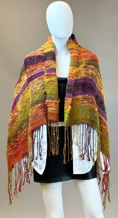 This uniquely designed, one of a kind Southwest flavor art shawl can be used for any occasion! Dress up or throw on a pair of boots and jeans. This shawl has 6mm decorative gold metal beads hand tied into the fringe so you get the added benefit of the drape when wearing this beautiful wrap.  This shawl measures 50"x29"+7" fringe per side. Fall Multicolor Fringe Shawl, Festival Handwoven Shawl One Size, Bohemian Weaving Shawl For Fall, Handwoven Festival Shawl, One Size, Traditional Woven Shawl For Fall, Handwoven One-size Shawl For Fall, Handwoven Shawl For Fall, One Size, Bohemian Fall Shawl With Weaving, Yellow Shawl For Fall