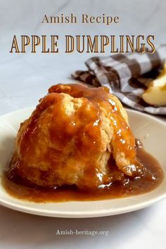 an apple dumpling on a plate with caramel sauce