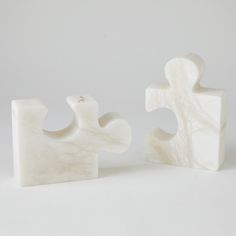 two pieces of white marble sitting next to each other