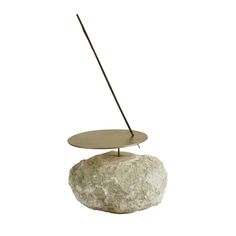 a rock with a metal stand on it