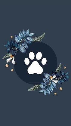 an animal's paw is surrounded by blue leaves and stars on a dark background