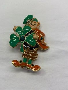 Bob Mackie brooch shipped with USPS First Class Package. Great for any occasion Enamel Brooch Lapel Pin Gift, Green Enamel Pin Brooch For Gift, Green Brooch Enamel Pin For Gift, Green Enamel Brooch Pin As Gift, Gold Novelty Brooches For Gifts, Novelty Brooch Jewelry Gift, Bob Mackie, First Class, Vintage Watches