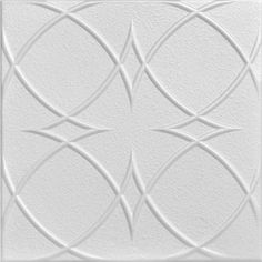 a white ceiling tile with an intricate design