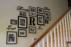 the family wall is decorated with pictures and letters on it's sides, along with stairs