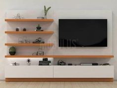 an entertainment center with shelves and a flat screen tv mounted on it's wall