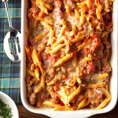 a casserole dish filled with pasta and meat