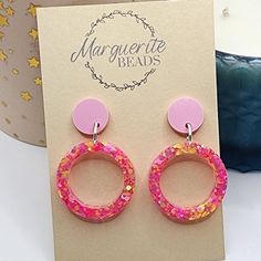 These Pink round earrings are the perfect set of earrings for everyday wear. They are made from Resin and Glitter. They would make the perfect gift for someone special. Please note - The glitters and colours in the earrings maybe different slightly from the photos because of lighting ect but i do my best to make sure they are very similar. If you have any questions, please message me. Happy shopping OTHER INFORMATION Shipping: Domestic Shipping will take 1 to 6 days - Express Shipping is available at an extra cost. International Shipping will take 6 to 10 Business Days - Express Shipping is available at an extra cost. Items can be posted within 14 Days Personalised Orders: Custom orders are not returnable, refundable or exchangeable due to their personalised nature. Colour: Actual colour m Pink Round Earrings For Birthday, Pink Round Birthday Earrings, Handmade Round Earrings For Birthday, Pink Circle Earrings As A Gift, Pink Circle Earrings For Gift, Pink Circle Earrings For Gifts, Hypoallergenic Round Earrings For Birthday, Round Dangle Earrings, Diy Resin Projects