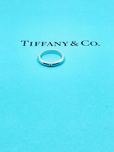 Authentic TIFFANY&Co. sterling silver narrow band ring. Condition: Pre-owned in very good condition.This item does not come with TIFFANY&Co box and pouch. Tiffany And Co Box, Sterling Silver Rings Bands, Silver Band Ring, Sterling Silver Bands, Silver Band, Tiffany & Co., Sterling Silber, Band Ring, Band Rings