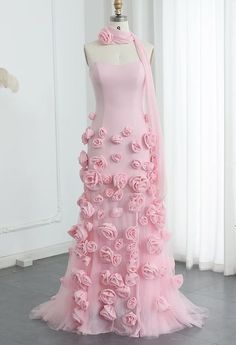 This gown is a striking shade of pink, featuring a strapless design with a sweetheart neckline that elegantly accentuates the collarbone and shoulders. The standout feature of the gown is the intricate 3D rose detailing, which adds a touch of romance and sophistication. The gown is complemented by a matching 3D rose neck choker, creating a cohesive and eye-catching look. This outfit is perfect for a formal event or a special occasion where you want to make a memorable impression.  Production tim 3d Flower Fashion, Rose Flower Dress, 3d Flower Dress, Pink Rose Dress, Flower Prom Dress, Prom Dress With Train, Glam Dress, Barbie Core, Dress With Train