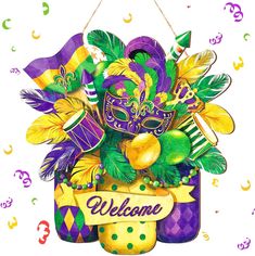 a mardi gras mask hanging on a welcome sign