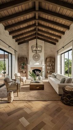 a living room filled with furniture and a fire place