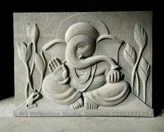 an elephant is sitting in the middle of a carving