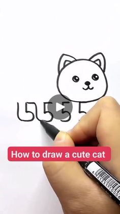 someone is drawing a cute cat on paper